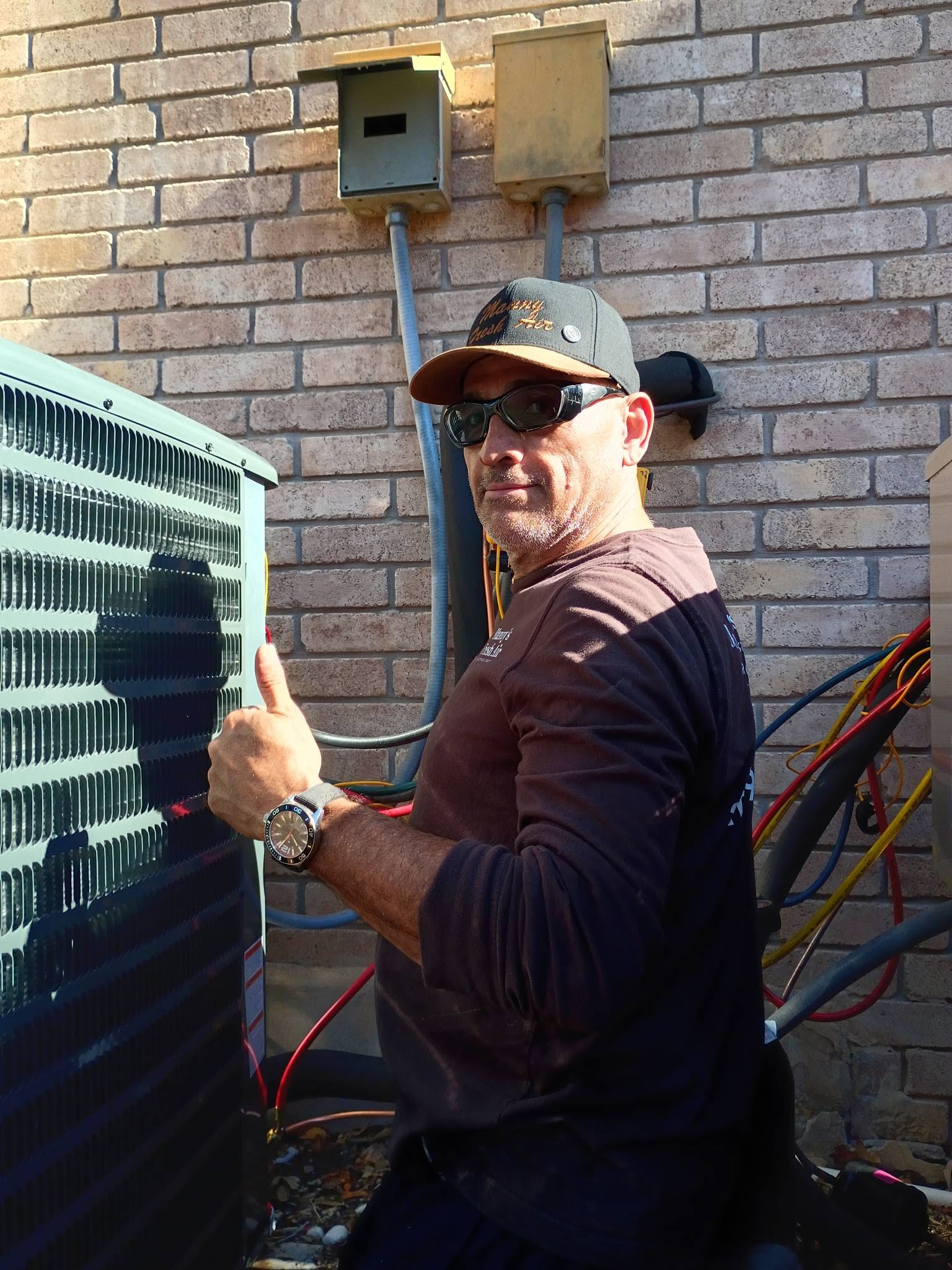 Manny doing a maintenance tune-up on a condenser